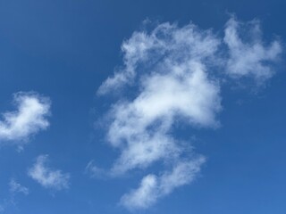 Dynamic composition of pure white clouds, textured against a bright blue sky, unique clouds,...