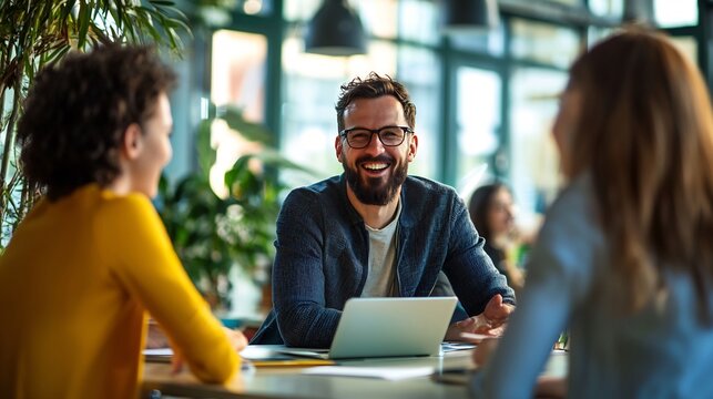 Dynamic entrepreneur mentoring young business leaders in an innovative co working space