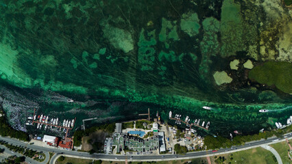 Aerial view of the Cancun lagoon on a sunny day with clear waters.