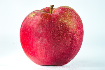 Fresh Red Apple with Water Droplets on white background