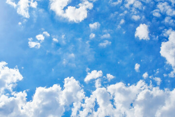 Blue sky with white fluffy cloud. Cumulus clouds background. Cloudscape morning sky. The concepts of freedom of life, never give up and positive though energy.