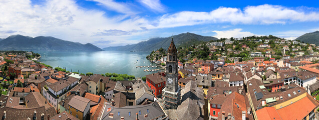  Switzerland travel and landmarks - colorful charming town Ascona, lake Lago Maggiore near Locarno , canton Ticino . aerial drone panoramic view of old town.