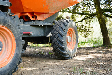 Detail of Mini Dumper Tire and Body at Construction Area. © Karen Images