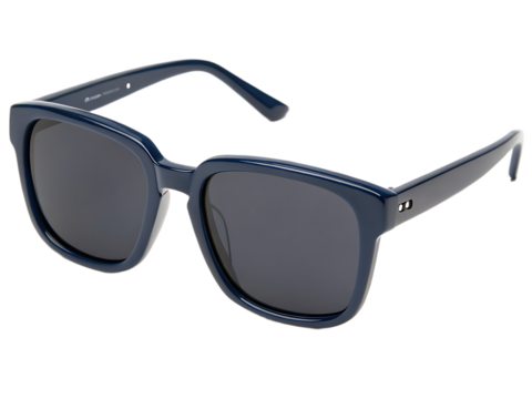 A close up shot of dark blue framed sunglasses with dark lenses on a black background in a studio