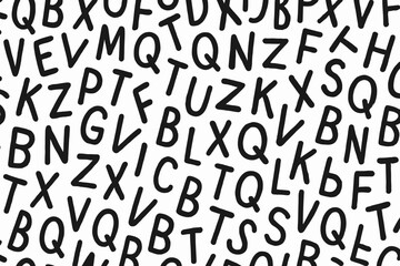 Random unreadable letters collage background. Chaotic alphabet typography seamless pattern. Jumbled black handwritten font characters on white backdrop. Abstract type texture design illustration.