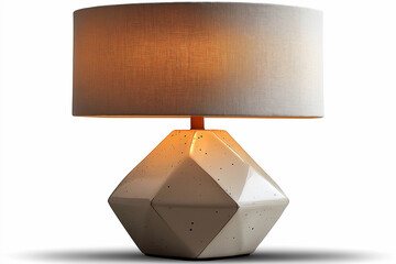 A unique geometric table lamp with a neutral linen shade, isolated on white.