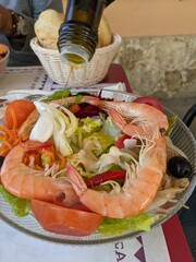 Fresh shrimp on a plate with salad