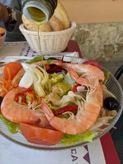 Fresh shrimp on a plate with salad