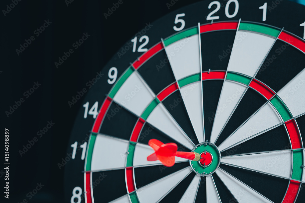 Aufkleber business target concept. focused dart hitting bullseye on traditional dartboard with numbers and seg