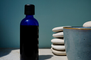 image showing a bottle filled with methylene blue on a sunny day