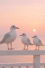 Three seagulls perched peacefully on a white wooden railing against a pastel-colored sunset sky and calm ocean backdrop, evoking serenity, connection, and coastal tranquility

