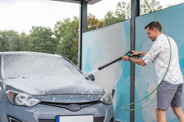 Car wash background. Car washing station foam. Man self service detail splash.
