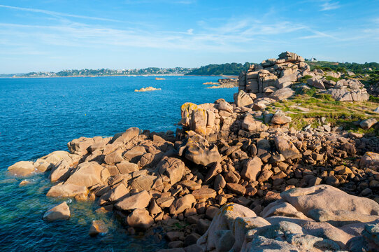 France,Bretagne.Pink granite rock formations at the coast  on a sunny summer evening