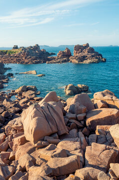 France,Bretagne.Pink granite rock formations at the coast  on a sunny summer evening