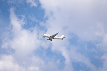 Passengers commercial airplane flying above clouds. Airplane in the sky, over the cloudy sky