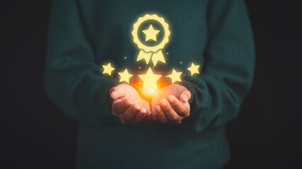 Person holding and showing the best quality assurance with golden five stars. Quality assurance of business services. Guarantee, Standards, ISO certification and testimonial concept.