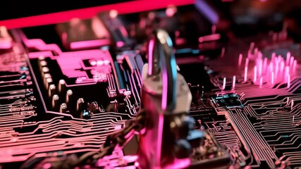 A padlock and chain resting on a computer circuit board under vibrant pink and blue neon lights, emphasizing data security. - Powered by Adobe