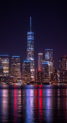 Night Photo of Dark Water Reflecting Lights of a City Skyline