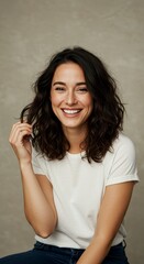 Portrait Smiling Brunette Woman With Curly Hair In A Studio Setting