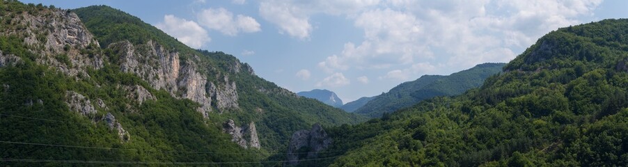 Naklejka premium Rhodopes, are a mountain range in Southeastern Europe. Bulgaria. Panorama. The forest area covers the mountains.