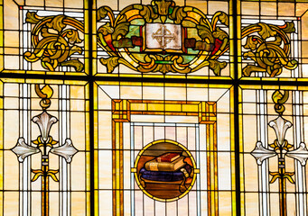 Stained glass window in a church showing a depiction of the Holy Bible_20101003_03686.