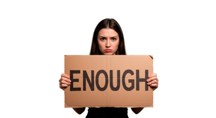 A young woman holds a sign with the word "enough" written on it, expressing discontent.
