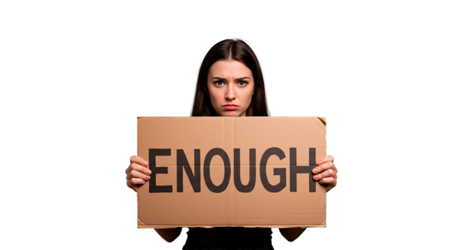A young woman holds a sign with the word "enough" written on it, expressing discontent.