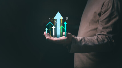 Businessman or trader showing business growth, investing in stock market or digital assets trading,...