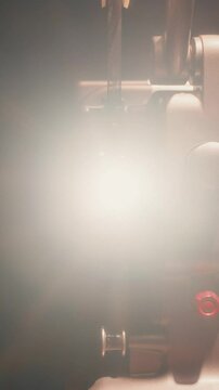 Bolex M8 Movie Projector Running In Dim Light With Glowing Projection Lens