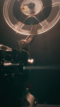 Old Bolex M8 Projector Functioning In Dark Room With Film Reels Turning