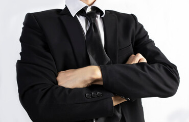 Businessman in black suit standing showing confidence in business and vision for work