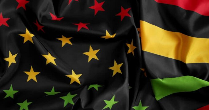 Juneteenth, Freedom Day, flag in the style of the US American flag in bold red, yellow, green and black colors to commemorate the ending of slavery on June 19th 1865 in the United States of America.