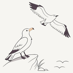 Two seagulls one flying one perched on a rock cliffside