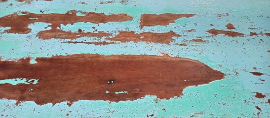 Weathered Aqua Paint Peeling from Rusty Surface