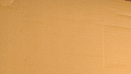 Background of brown kraft paper or cardboard texture. Abstract pattern of beige rough carton, 