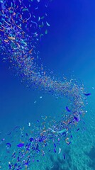 Fototapeta premium Abstract underwater confetti swirl