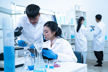 Multidisciplinary science students work in a modern lab analyzing microbial samples to support research in biology chemistry health and other scientific fields