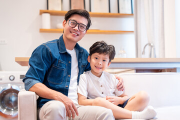 Father and son bonding indoors with smiles creating lasting memories together at home