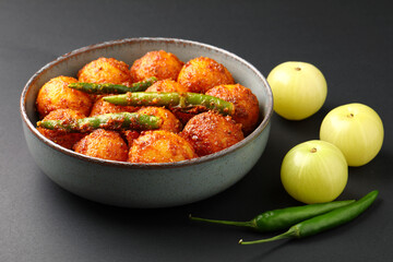 Homemade Amla and Green Chilli Pickle Preparation in Indian Kitchen
Amla Pickle or gooseberry pickle It is a spicy condiment made with Amla also known as Indian gooseberries,