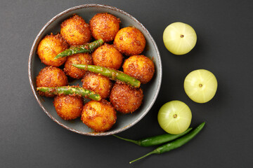 Homemade Amla and Green Chilli Pickle Preparation in Indian Kitchen
Amla Pickle or gooseberry pickle It is a spicy condiment made with Amla also known as Indian gooseberries,