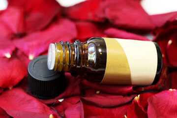 Rose essential oil and red rose. Cosmetic.