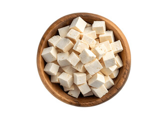 Diced tofu in a wooden bowl isolated on transparent background, top view, healthy food