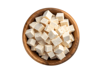 Diced tofu in a wooden bowl isolated on transparent background, top view, healthy food