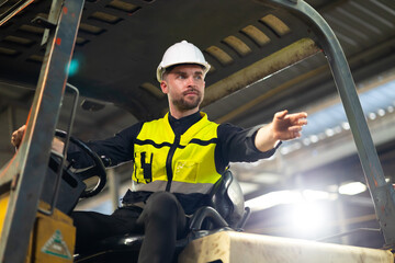 Drive forklift : Caucasian man staff driving forklift in industrial container warehouse....