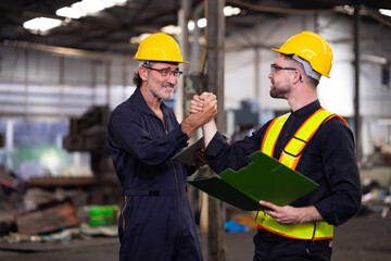 Two engineering man : Manufacture technical and factory staff working while Using digital tablet...