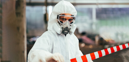 Officials from the Department of Hazardous substances control bureau is investigating the leak of a hazardous chemical in chemical industry plant. Man with safety protective mask in factory