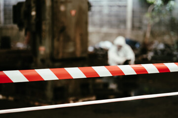 red barrier cross tape : No trespassing. Officials from the Department of Hazardous substances...