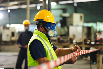 teamwork : Officials from the Department of Hazardous substances control bureau is investigating the leak of a hazardous chemical in chemical industry plant. Man with safety protective mask in factory
