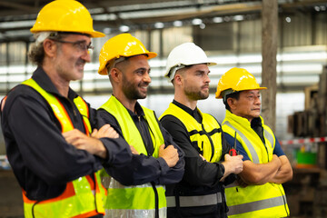 Arms crossed. Professional team working at workplace. Unity and teamwork concept. Portrait engineer factory manager worker and mechanic team together in factory workplace