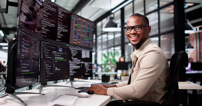 Smiling African-American Man Developing Web Code